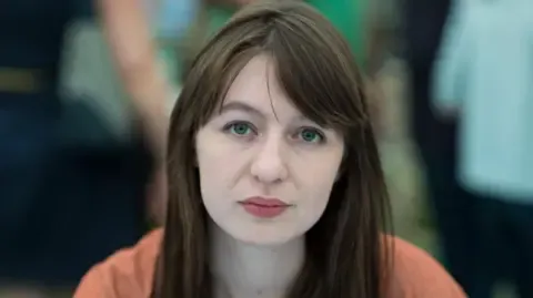 Sally Rooney claims she is unable to visit the UK over arrest fears